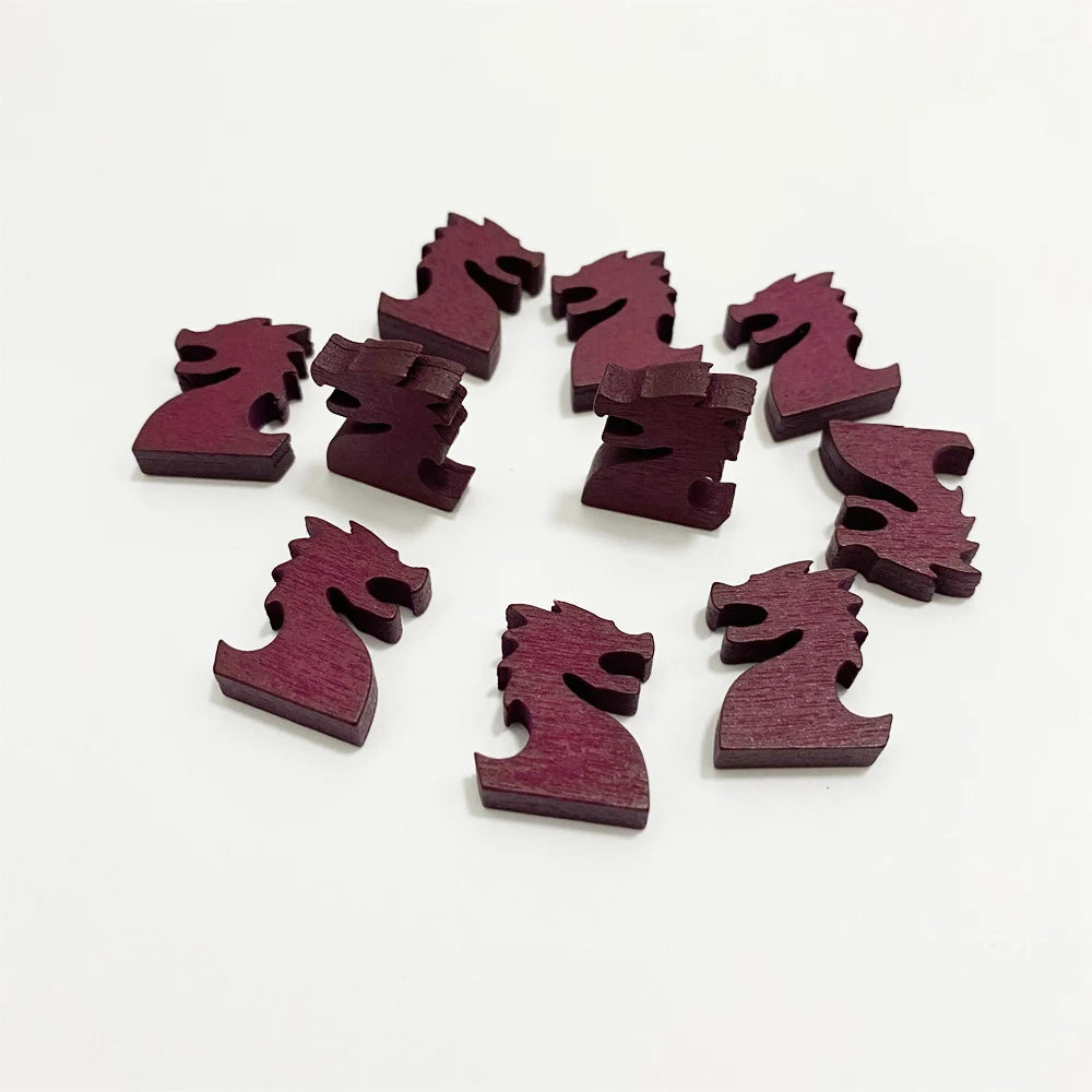 Wooden chess pieces shaped like horses on a white background